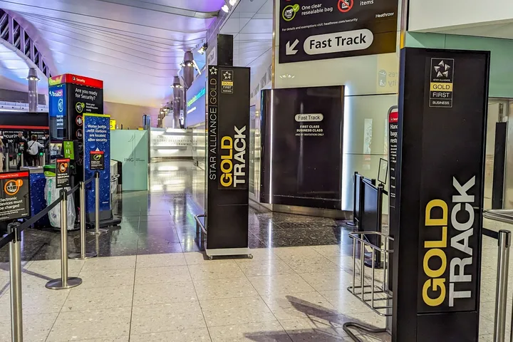 Star Alliance Gold Track fast-track security lane entrance signs at Heathrow airport.