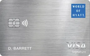 World of Hyatt Visa Signature credit card on brushed metal background.