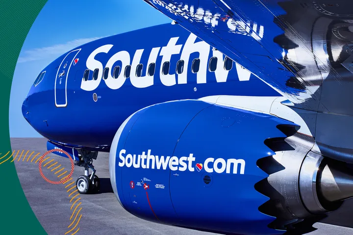 Two blue Southwest Airlines planes on tarmac showing Southwest.com branding on engine.