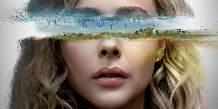 Stylized sci-fi movie poster showing a blonde woman's face with a surreal landscape dissolving across her eyes.