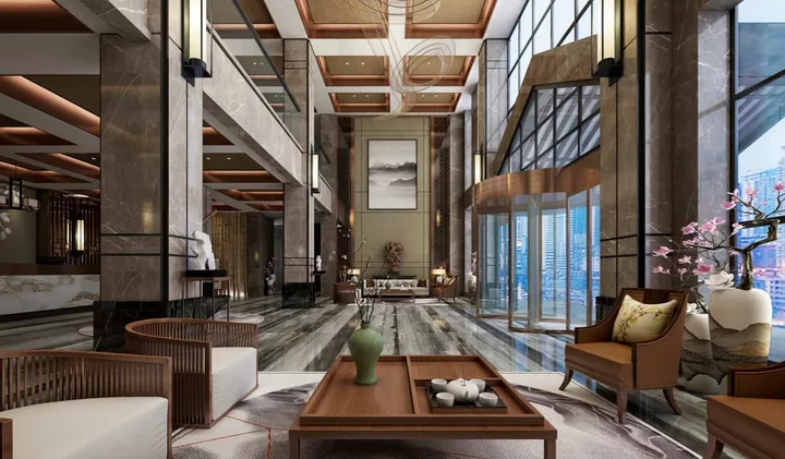 Luxurious modern hotel lobby with marble floors, high ceilings, and elegant Asian-inspired decor.