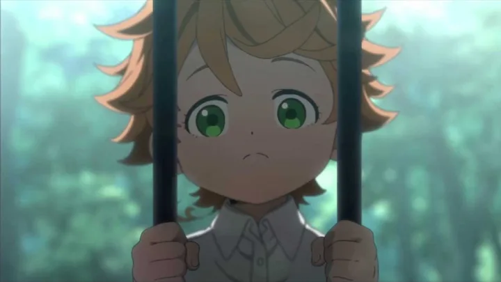 An anime child with green eyes grips iron bars, looking out with a fearful expression.