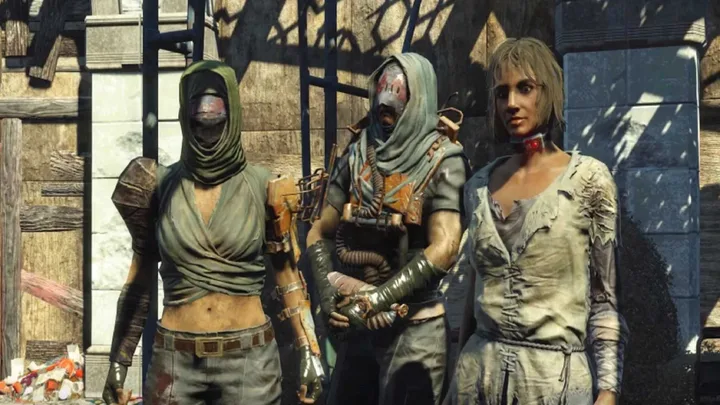 Three post-apocalyptic video game characters in ragged armor standing together in a ruined setting.