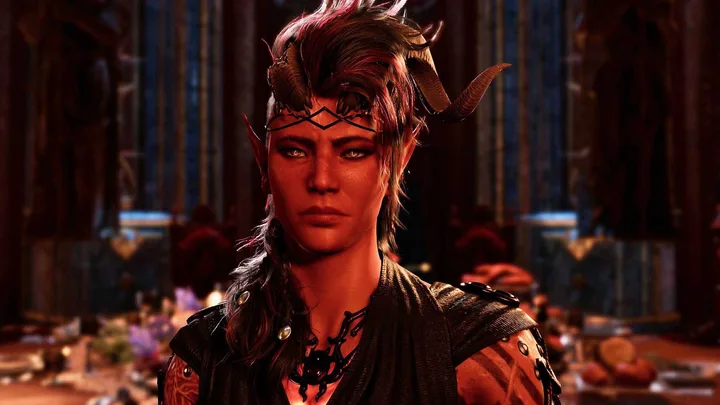 Close-up of a horned elf female video game character with intense expression in a warmly lit hall.