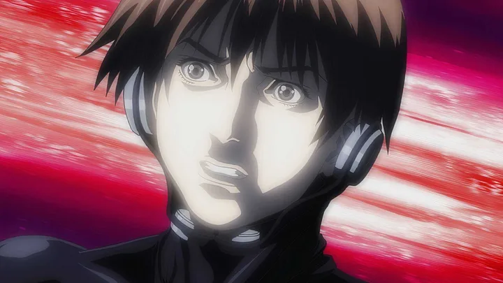 Close-up of a determined male anime character with intense expression against a red motion-blur background.