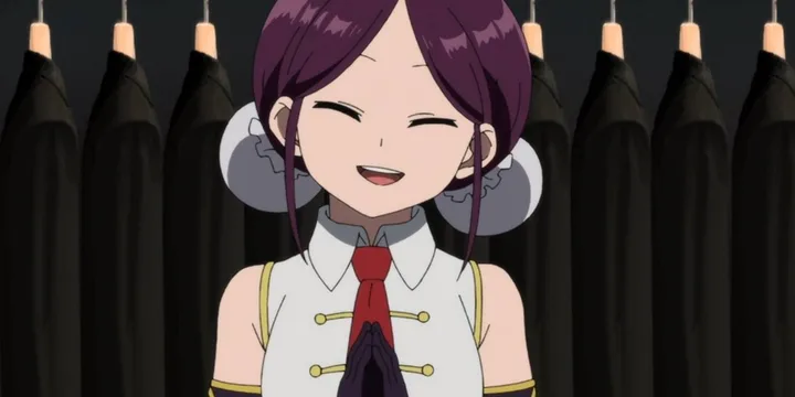 Smiling purple-haired anime girl in uniform standing in front of hanging dark cloaks.