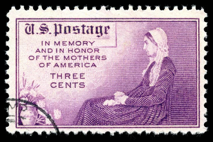 Purple U.S. postage stamp reading 'In Memory and In Honor of the Mothers of America, Three Cents.'