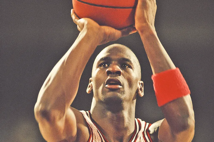 Male basketball player shooting a free throw in close-up action shot.