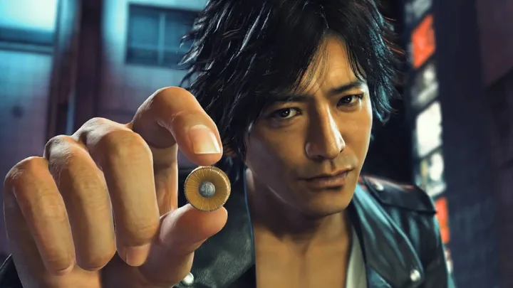 Judgment game protagonist Takayuki Yagami holding a coin toward the camera in a dark urban setting.